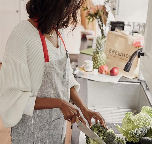 Person chopping vegetables from Erewhon