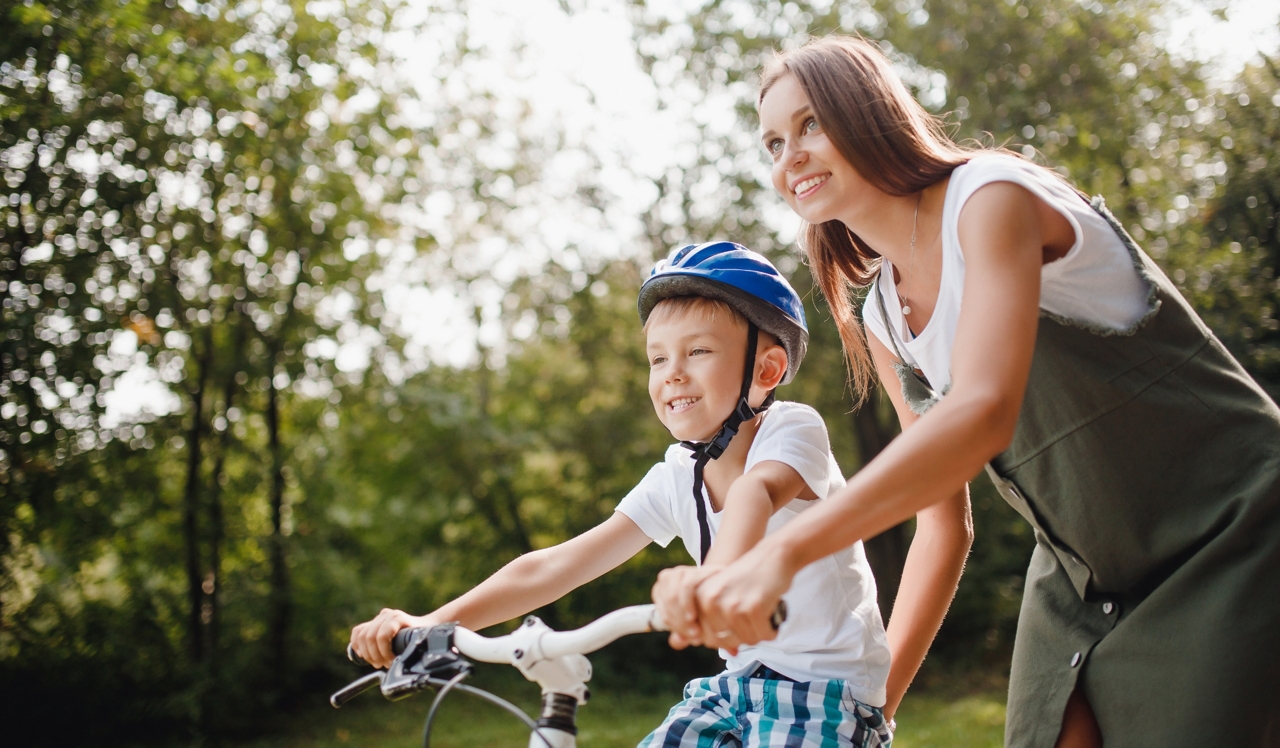 Olde Towne Residences - Raleigh, NC - Kid riding a bicycle in the park