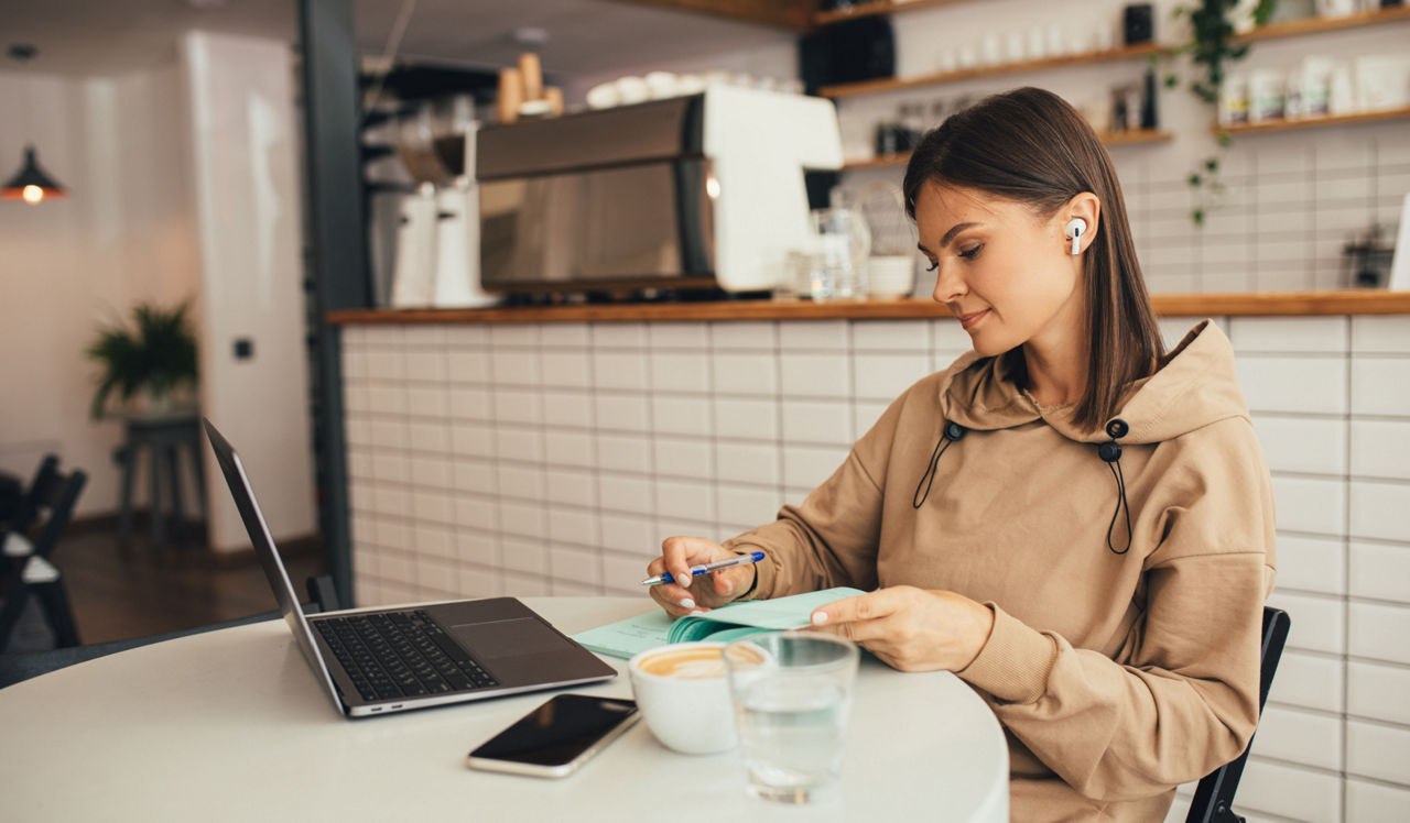 The Residences at Capital Crescent Trail - Bethesda, MD - Woman in coffee shop