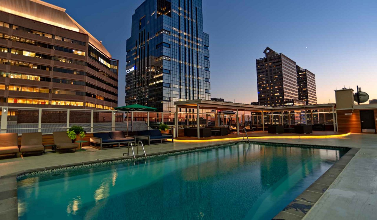 The Sterling Apartments rooftop pool deck with philadelphia city skyline in the background