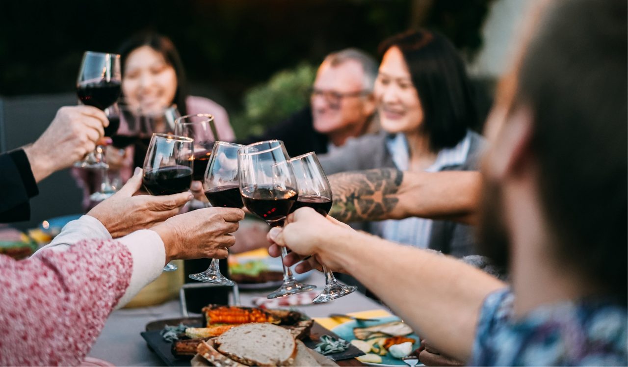 People with wine around a table