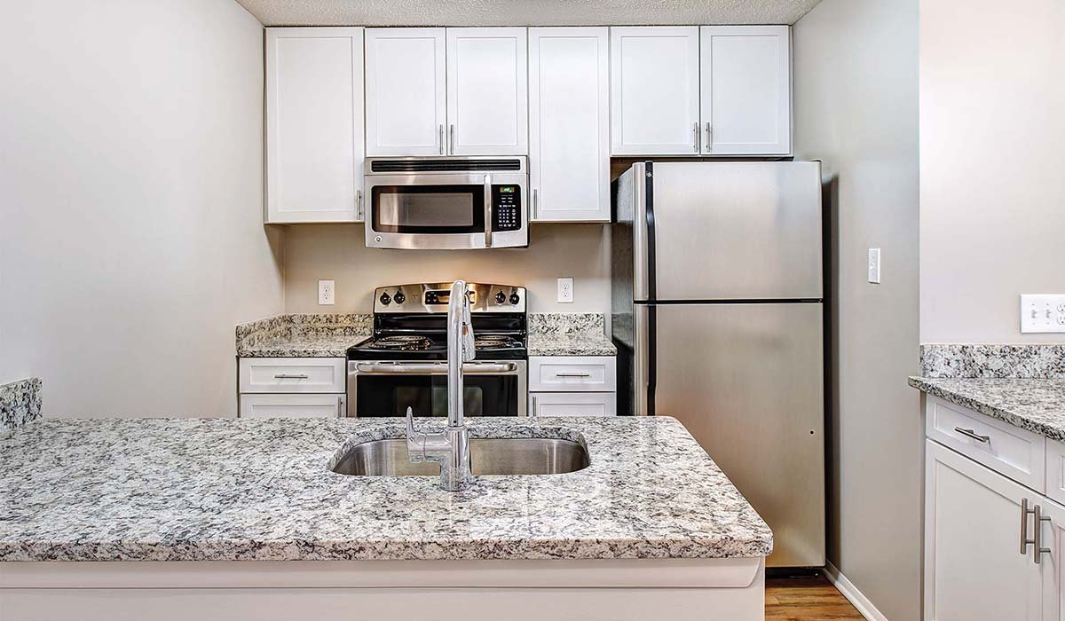 Burke Shire Commons Apartments - White Kitchen with Marbled Granite Countertops - Burke, Virginia