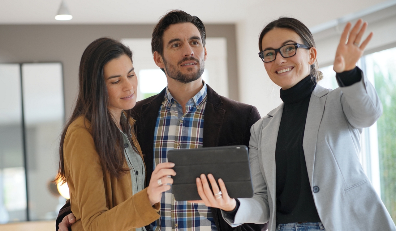 Couple taking a tour with a leasing agent