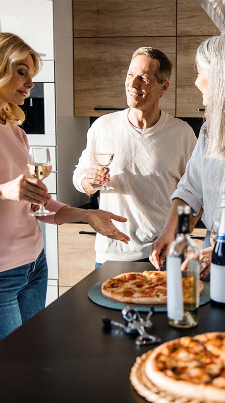 Flamingo Point | Miami, FL | Three friends conversing in kitchen