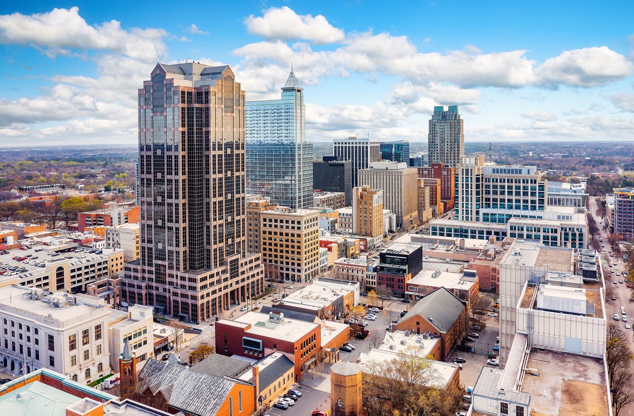 Aerial view of Raleigh, North Carolina skyline on a sunny day.