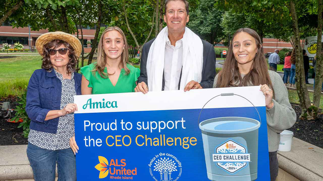 President and CEO Ted Shallcross and three other Amica employees hold sign saying Proud to Support the CEO Challenge