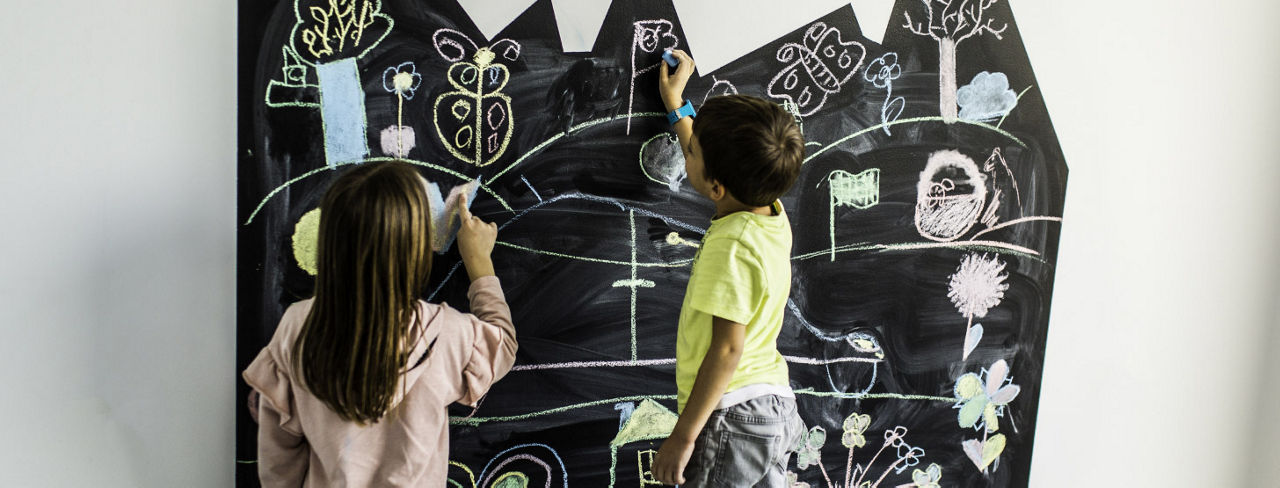 Decorated walls in basement playroom.