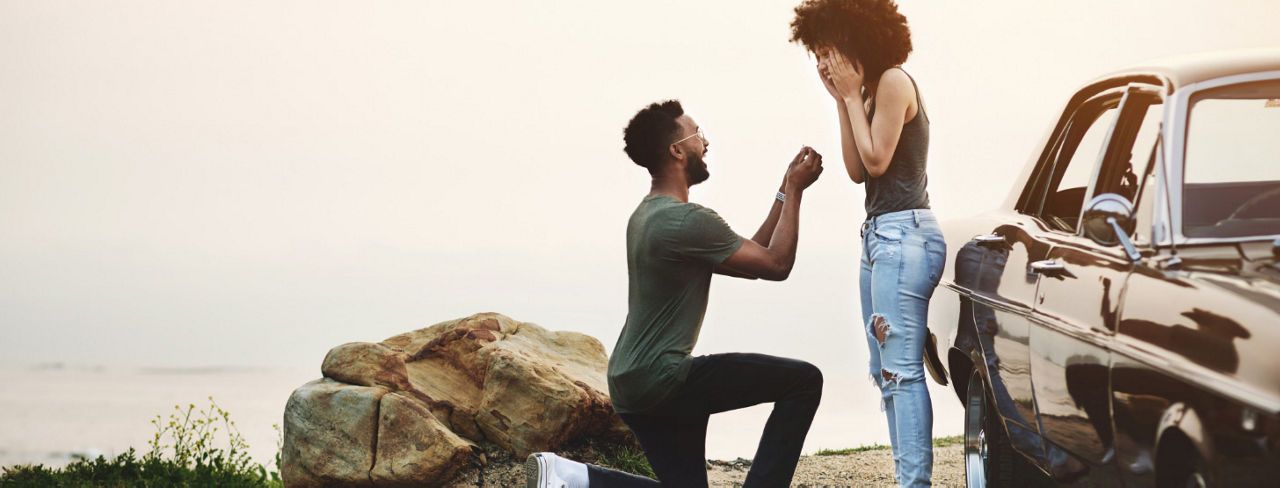 A man proposing to a woman.