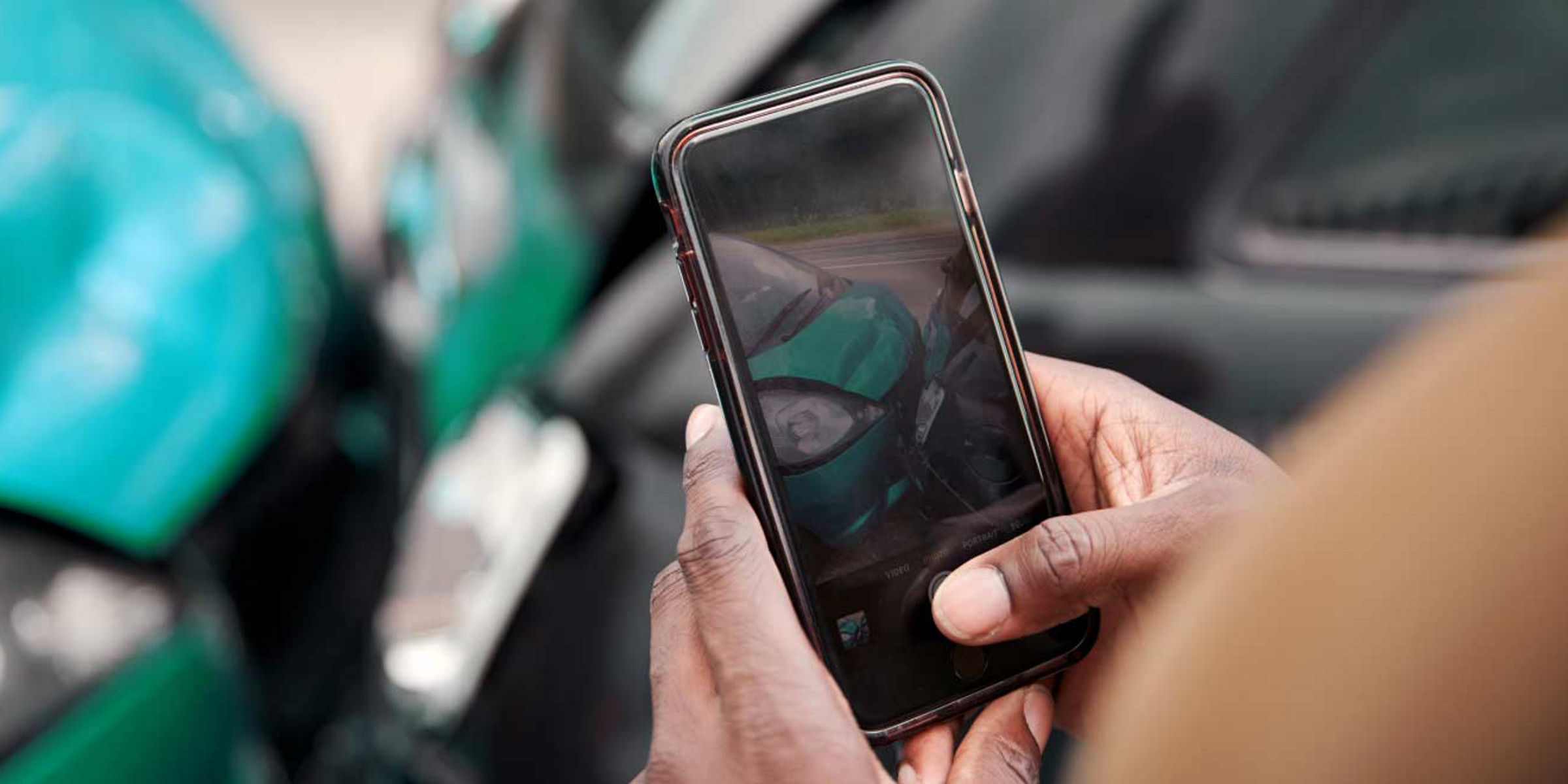 Taking a photo of the damage with a smartphone