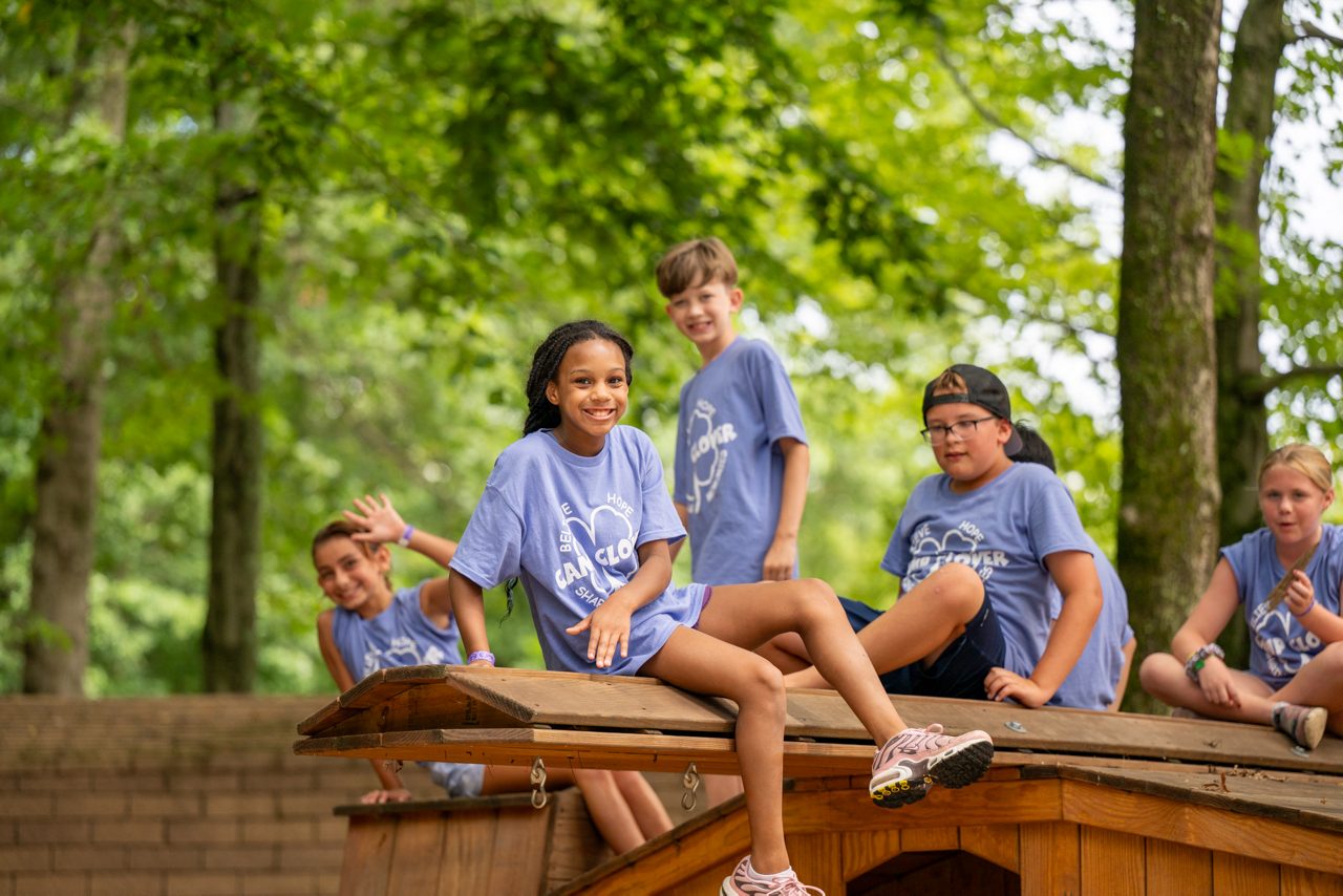 group of kids smiling at camp clover