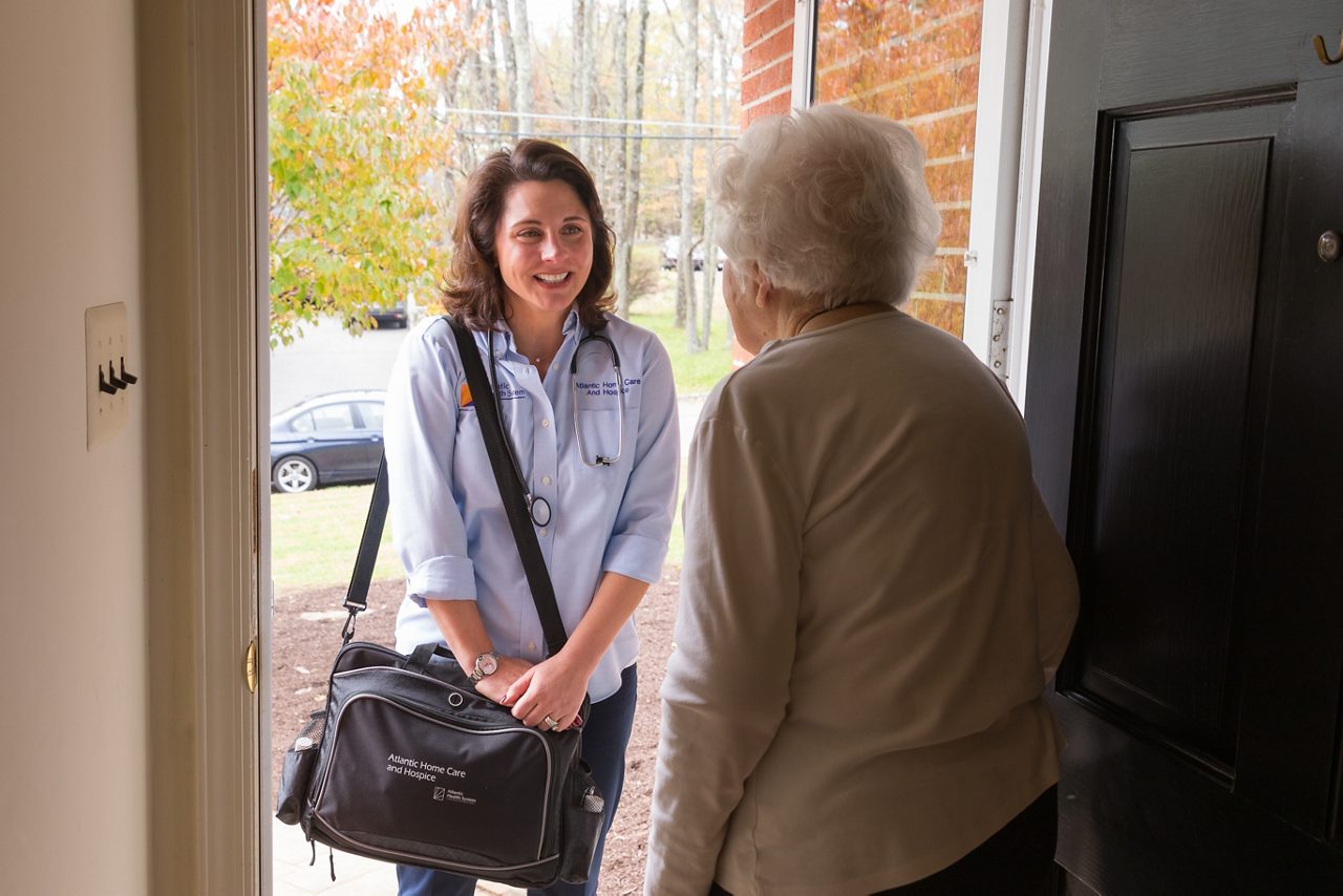 visiting nurse at woman's door