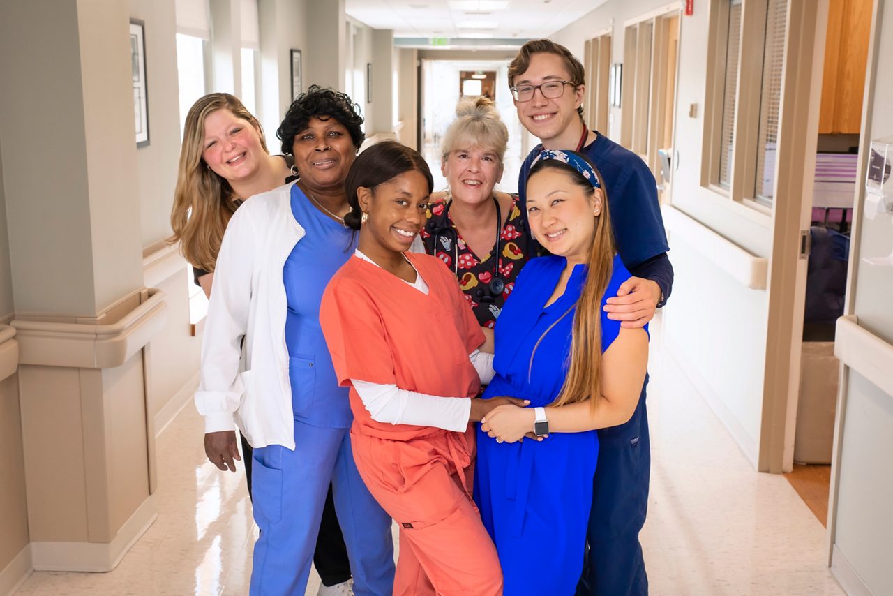 A group of diverse, happy, AHS nurses.