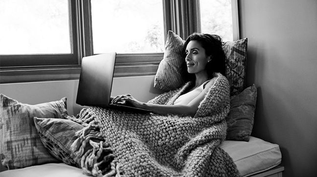 woman on couch with laptop