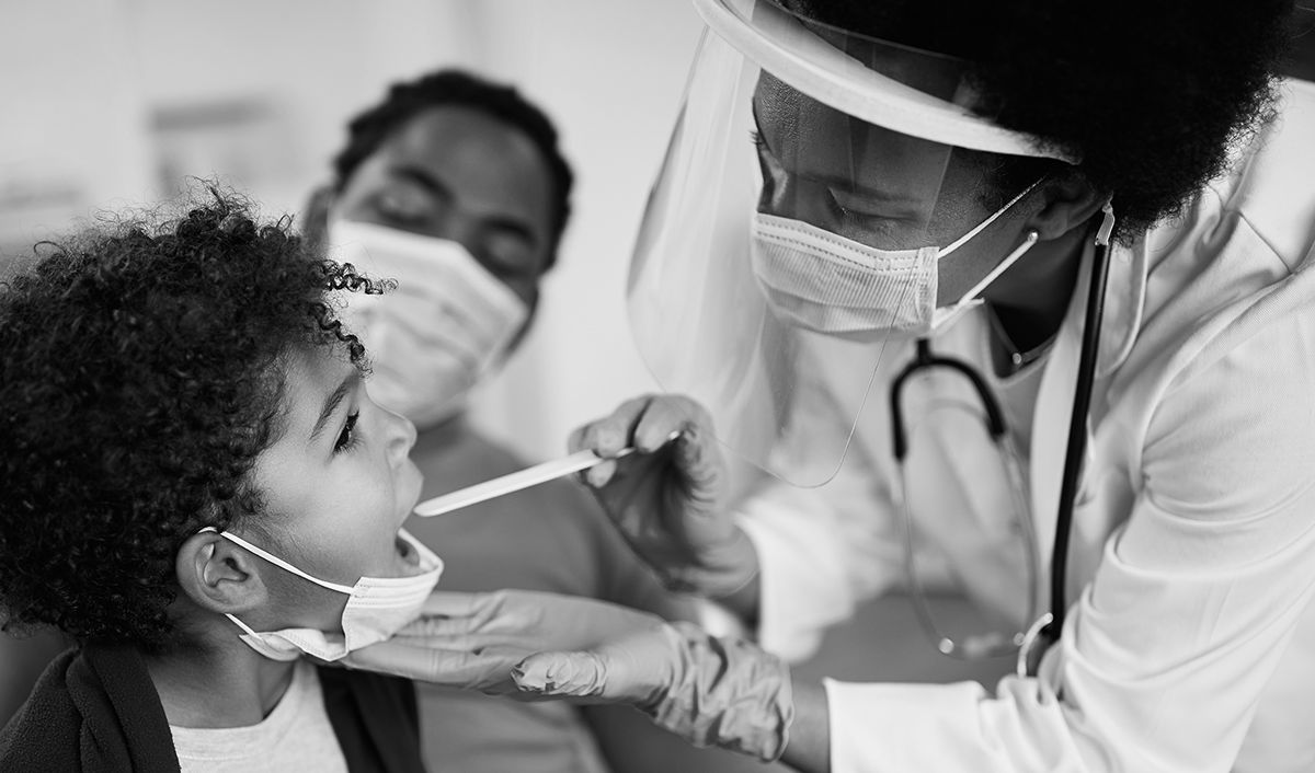 Doctor examining young patient