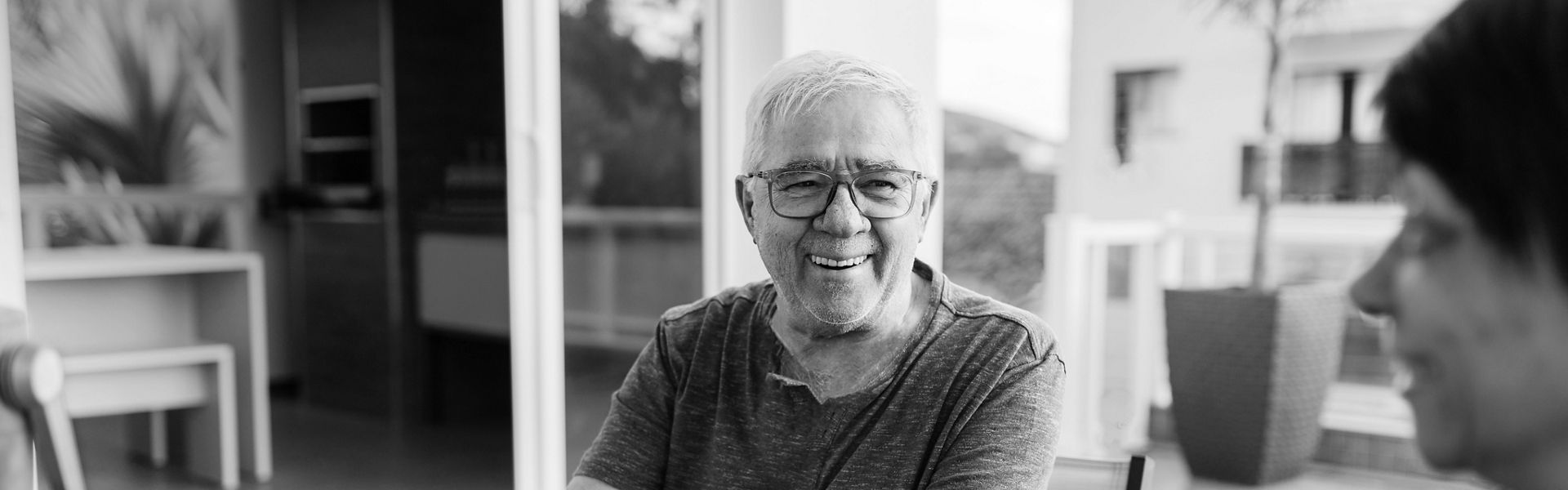 Man at table smiling