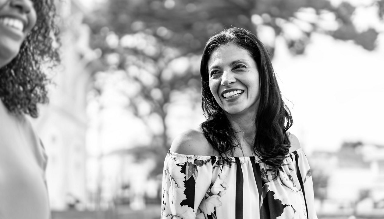 Woman outside smiling 