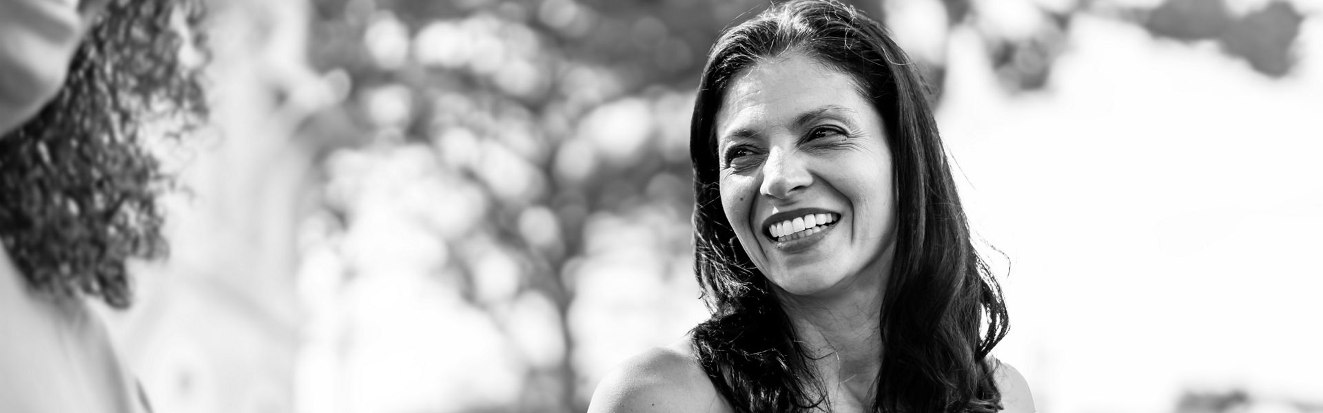 Woman outside smiling 
