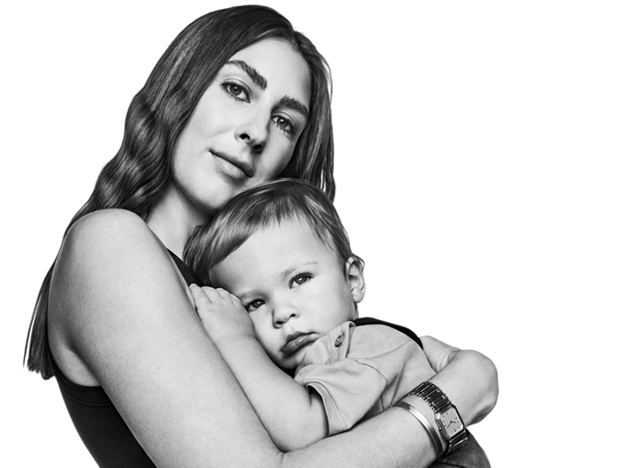 A mother embracing her toddler