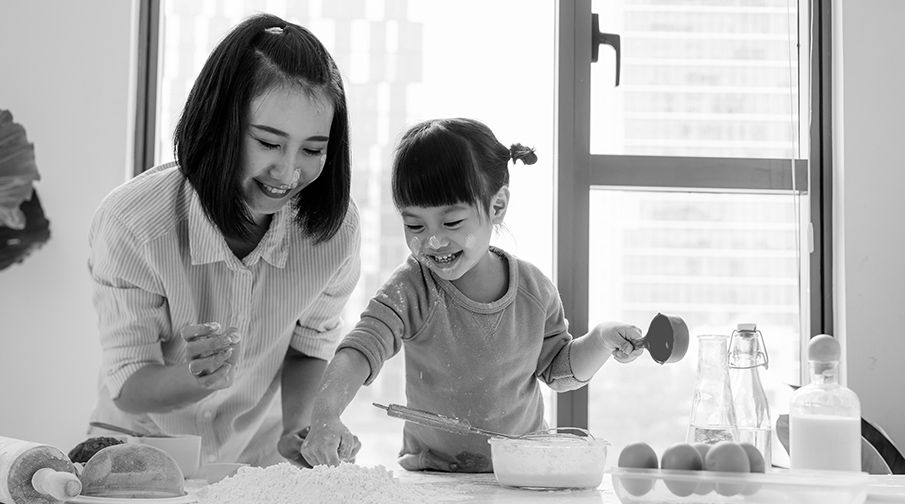 Mother and daughter baking