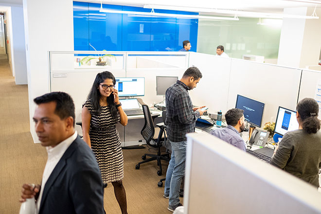 Coworkers in office pod