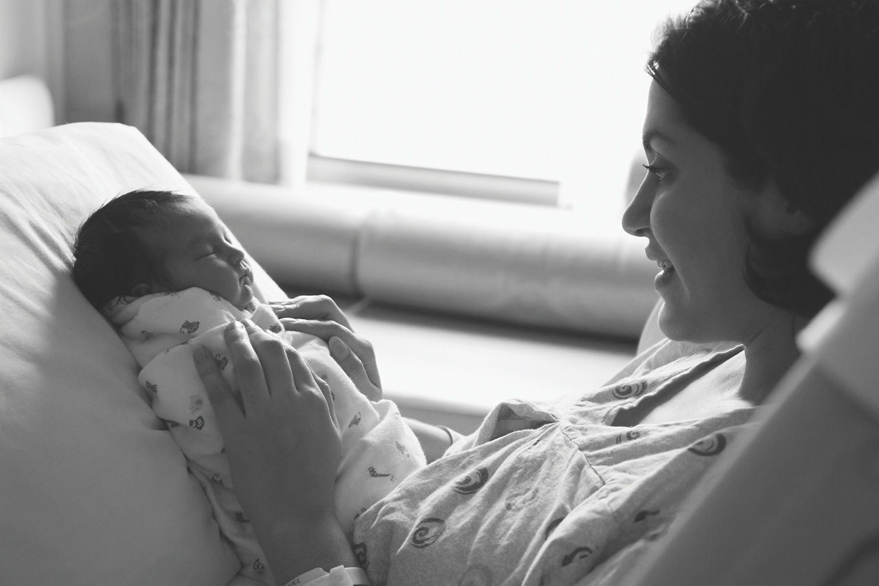 A family sharing a meal around a table outside