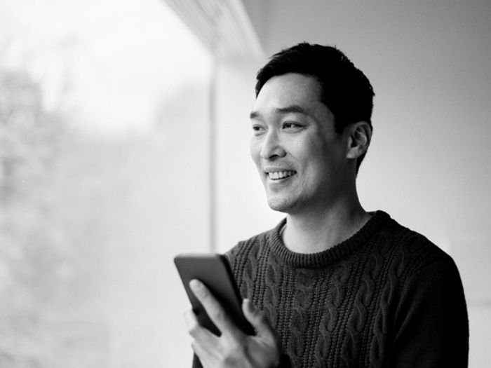 man smiling with phone