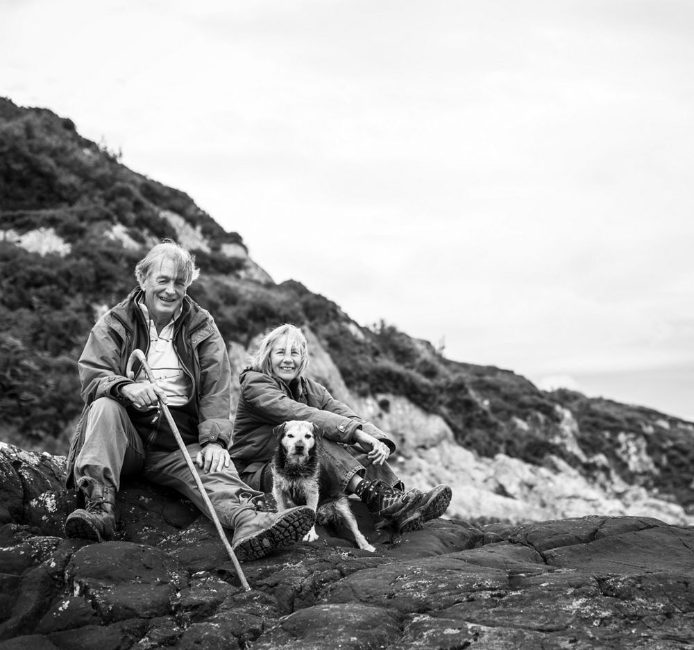 Man woman and dog on mountain