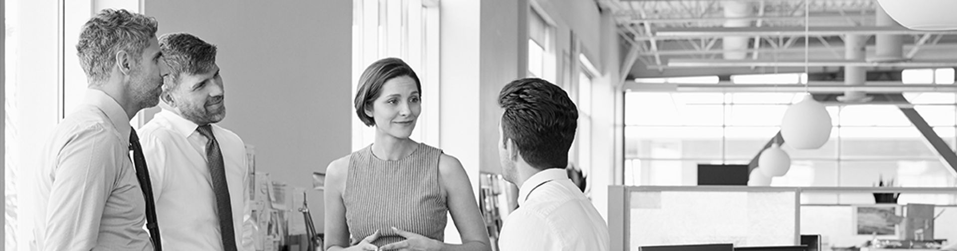 employees discussing benefits with a manager