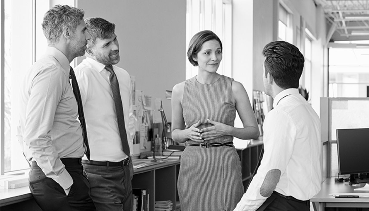 employees discussing benefits with a manager