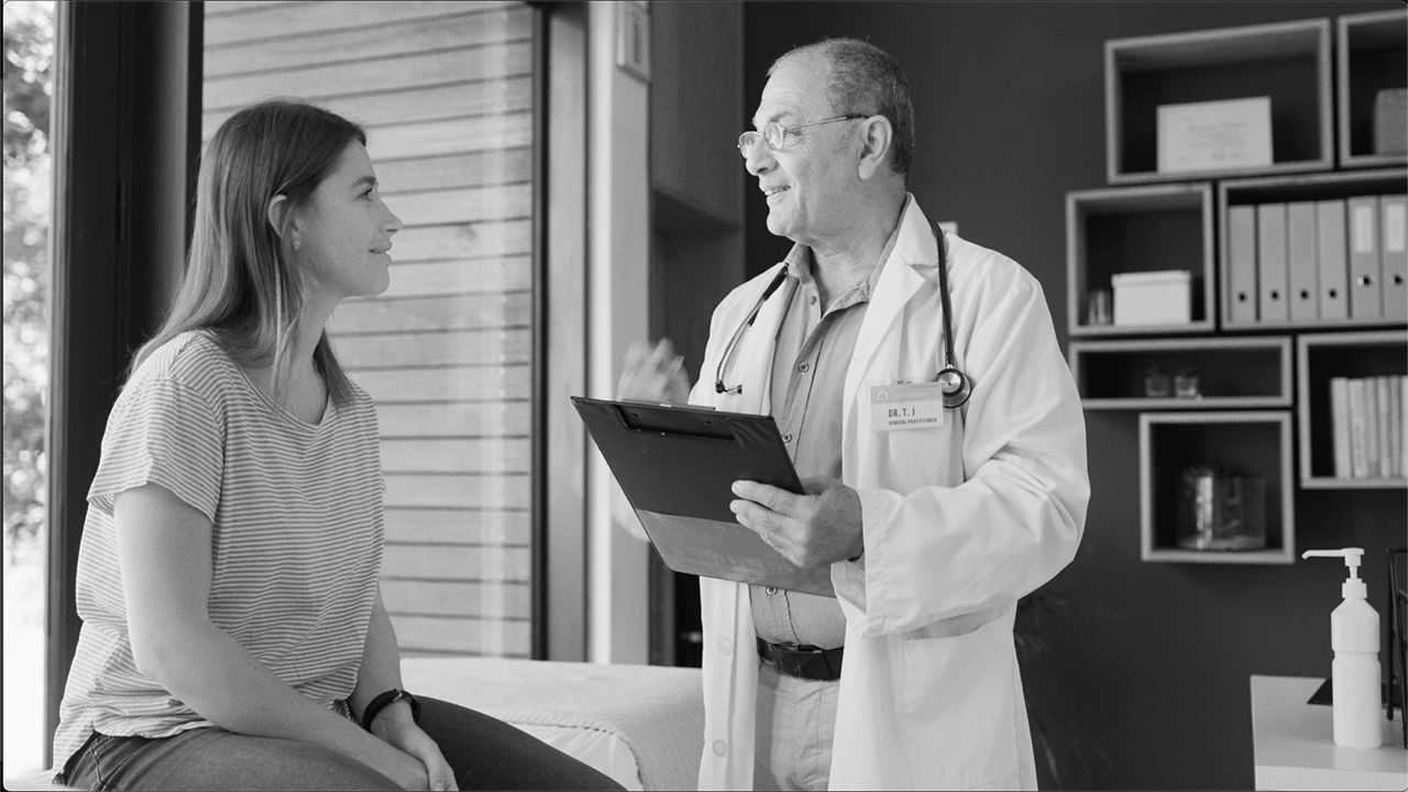 woman speaking to her in-person doctor Virtual Blue PPO plan