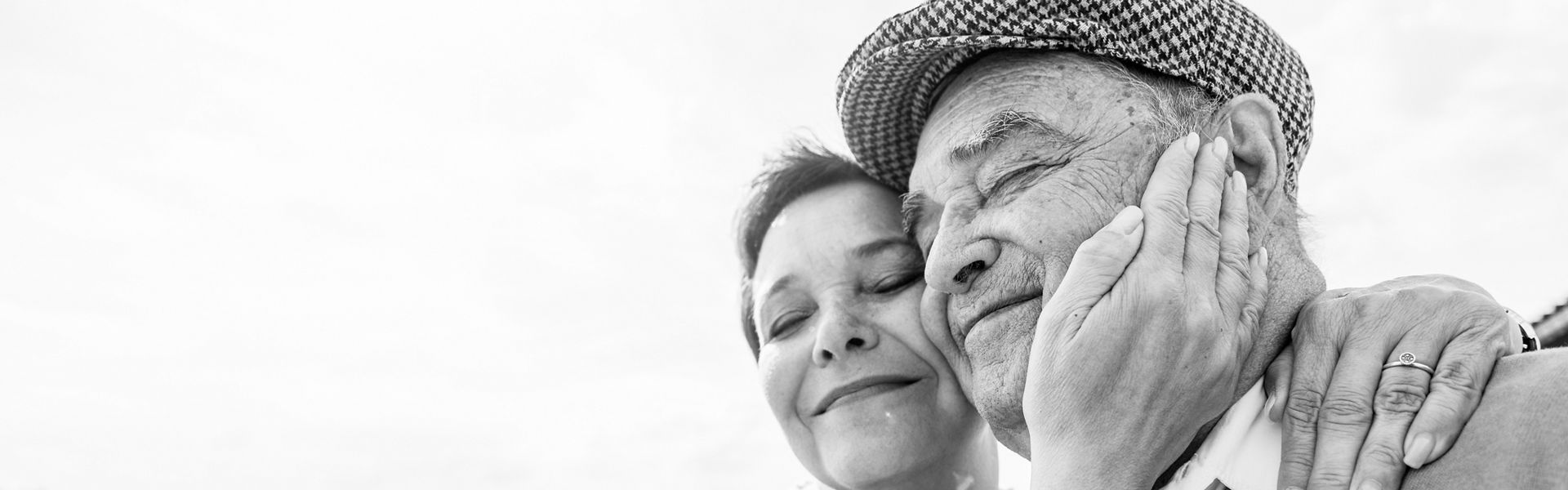 Senior couple looking hugging