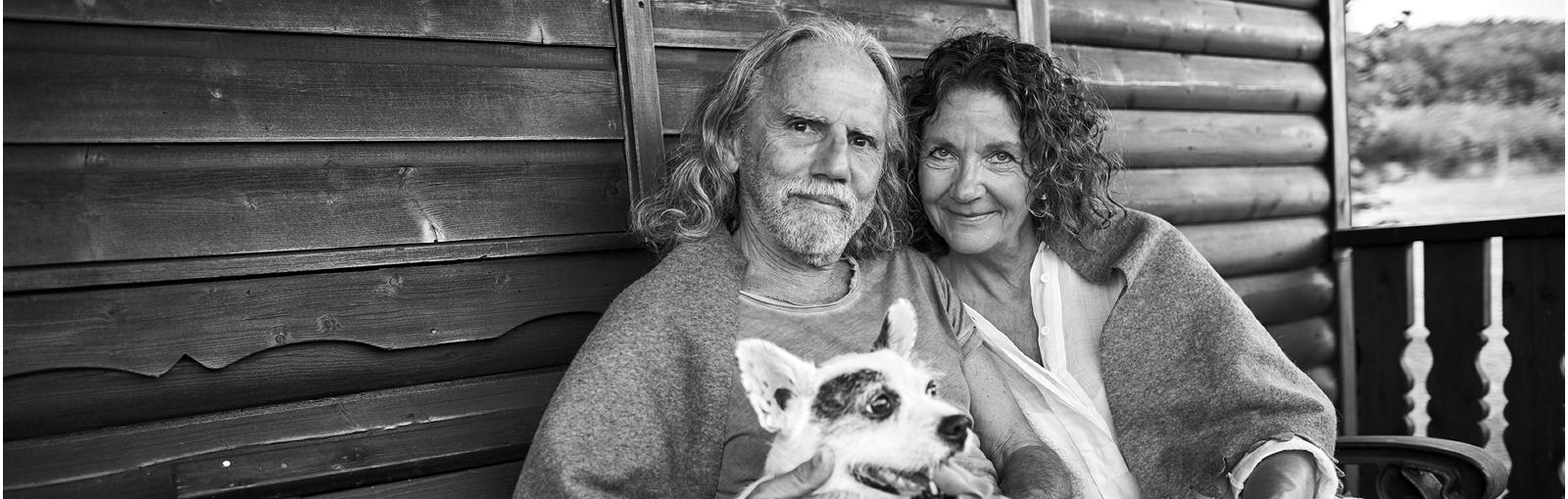 Senior couple on porch with dog