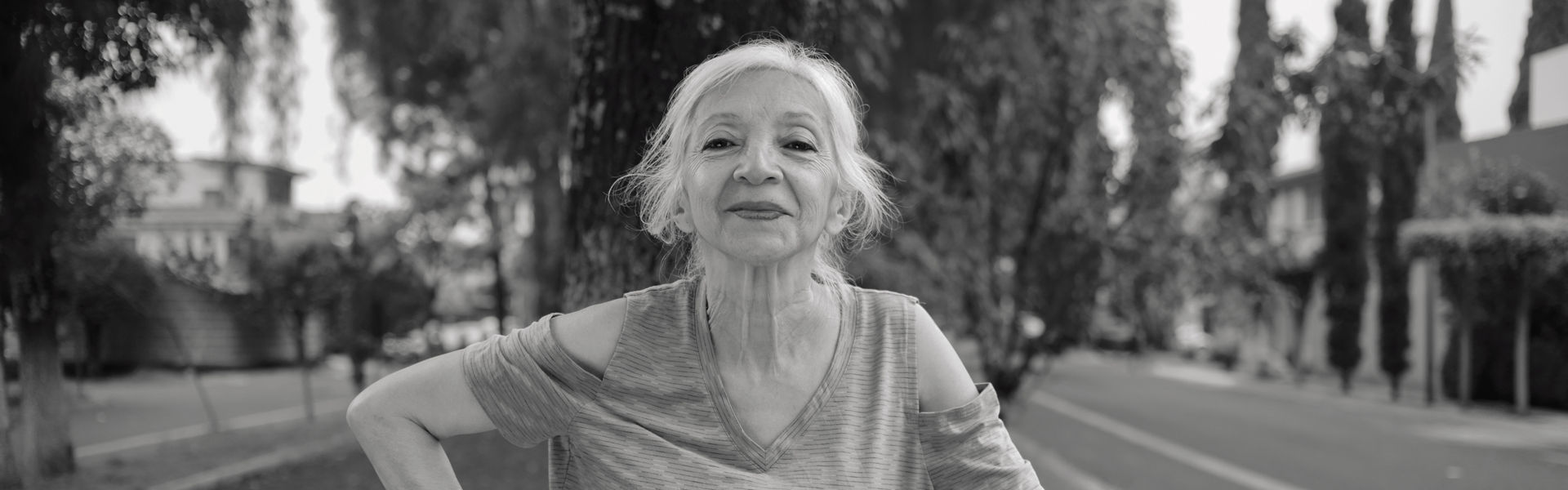 1062565330
Portrait of an elderly white-haired Mexican woman while she exercises in a public park.