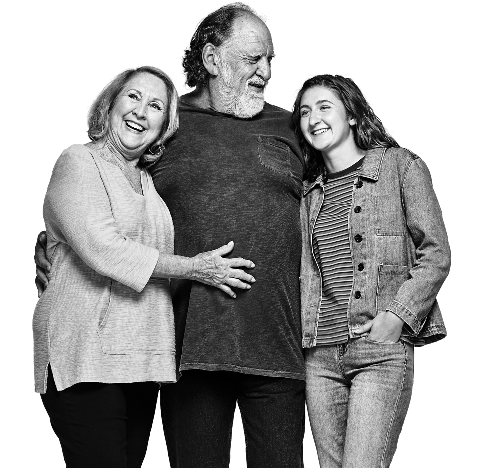 Three people embracing in a hug