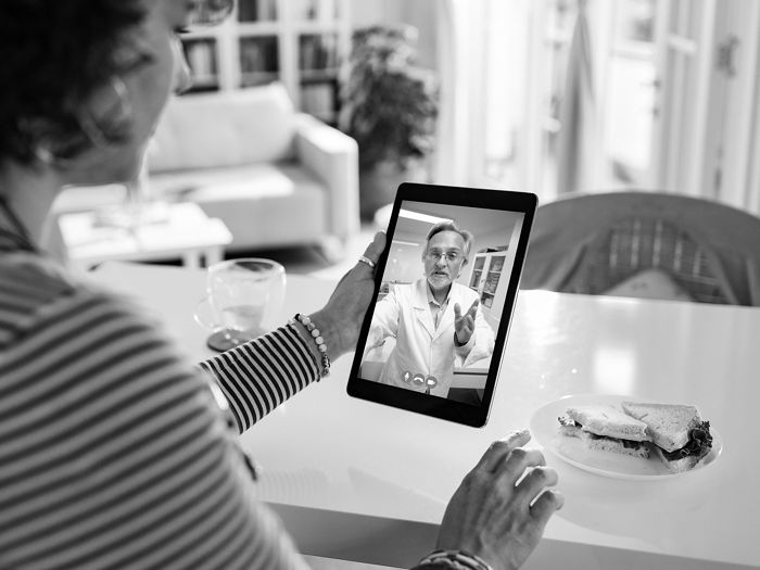 Woman using telehealth