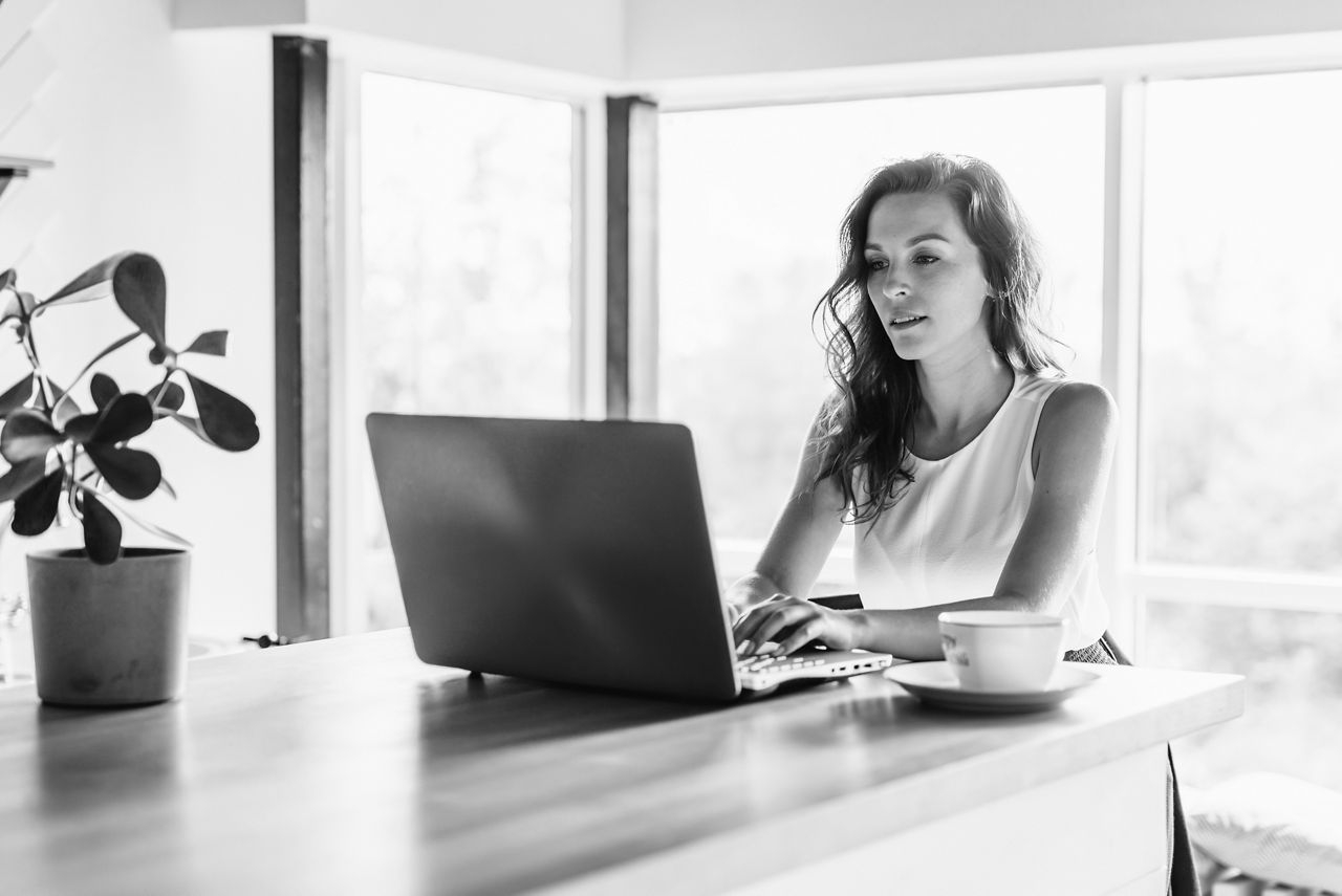 Woman at counter on laptop