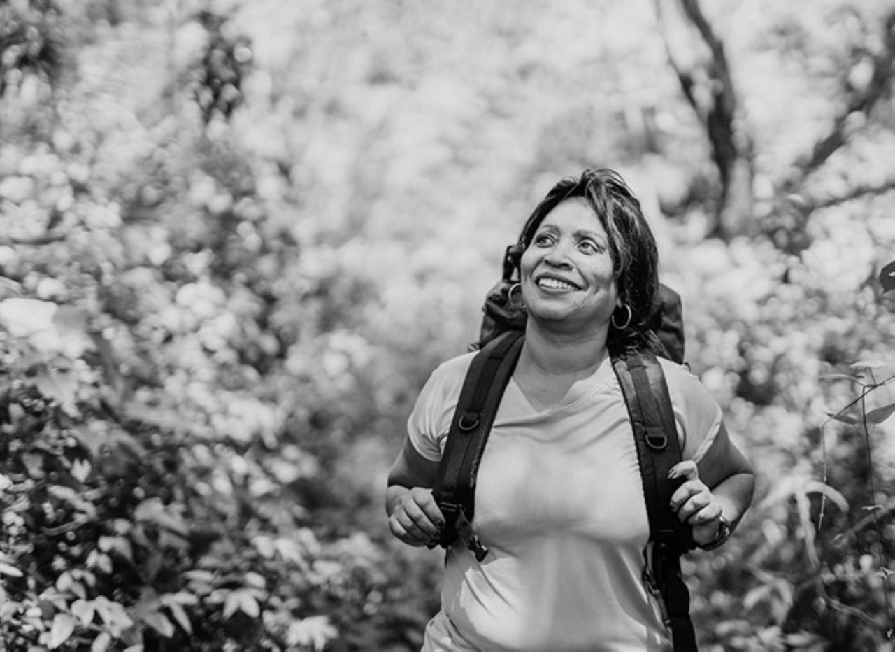 woman with backpack outside 