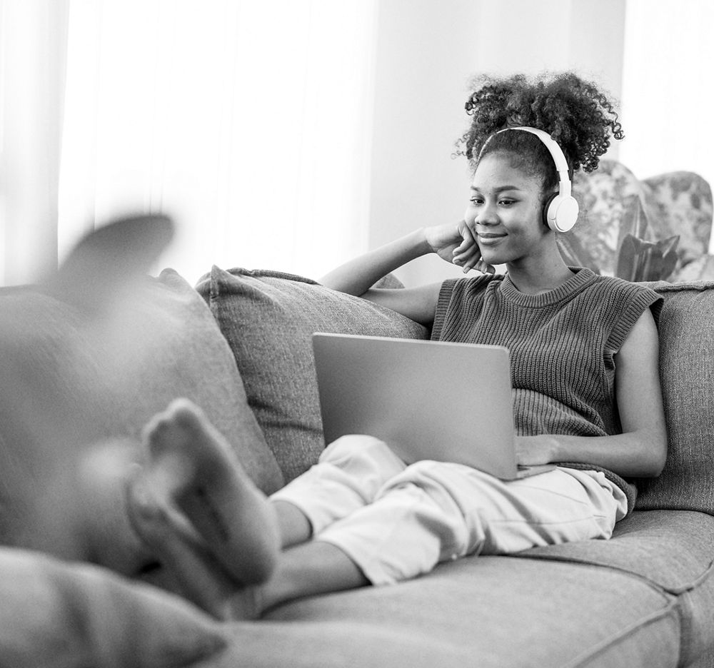 woman on couch with laptop