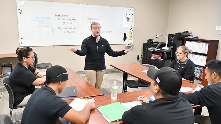 Teacher instructs students in Cambria english class