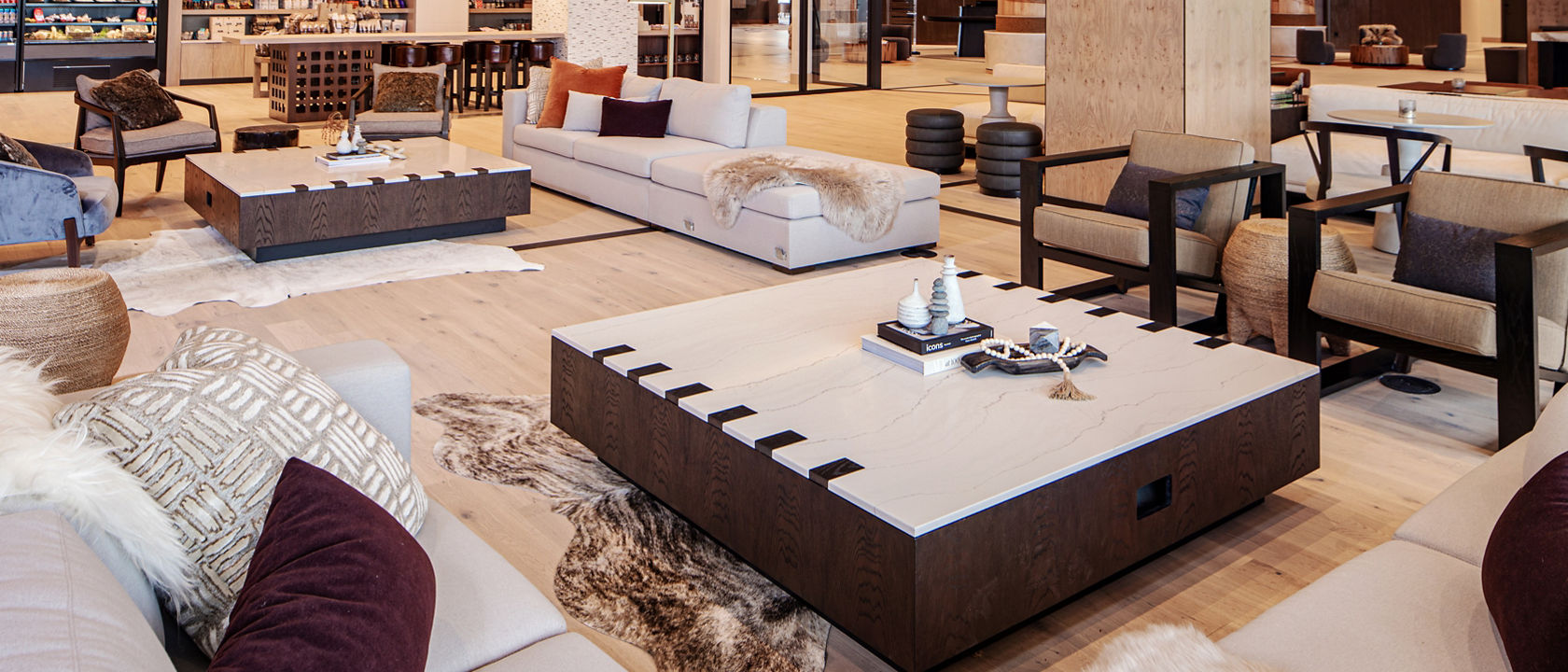 Hotel featuring multiple tables featuring quartz countertops.