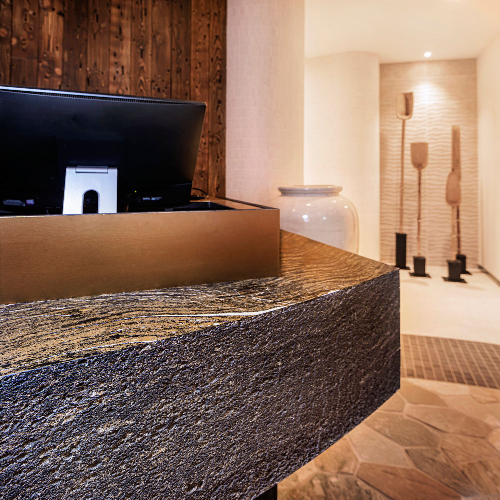 A reception desk featuring Cambria Golden Dragon Matte quartz to give an American Nordic theme.