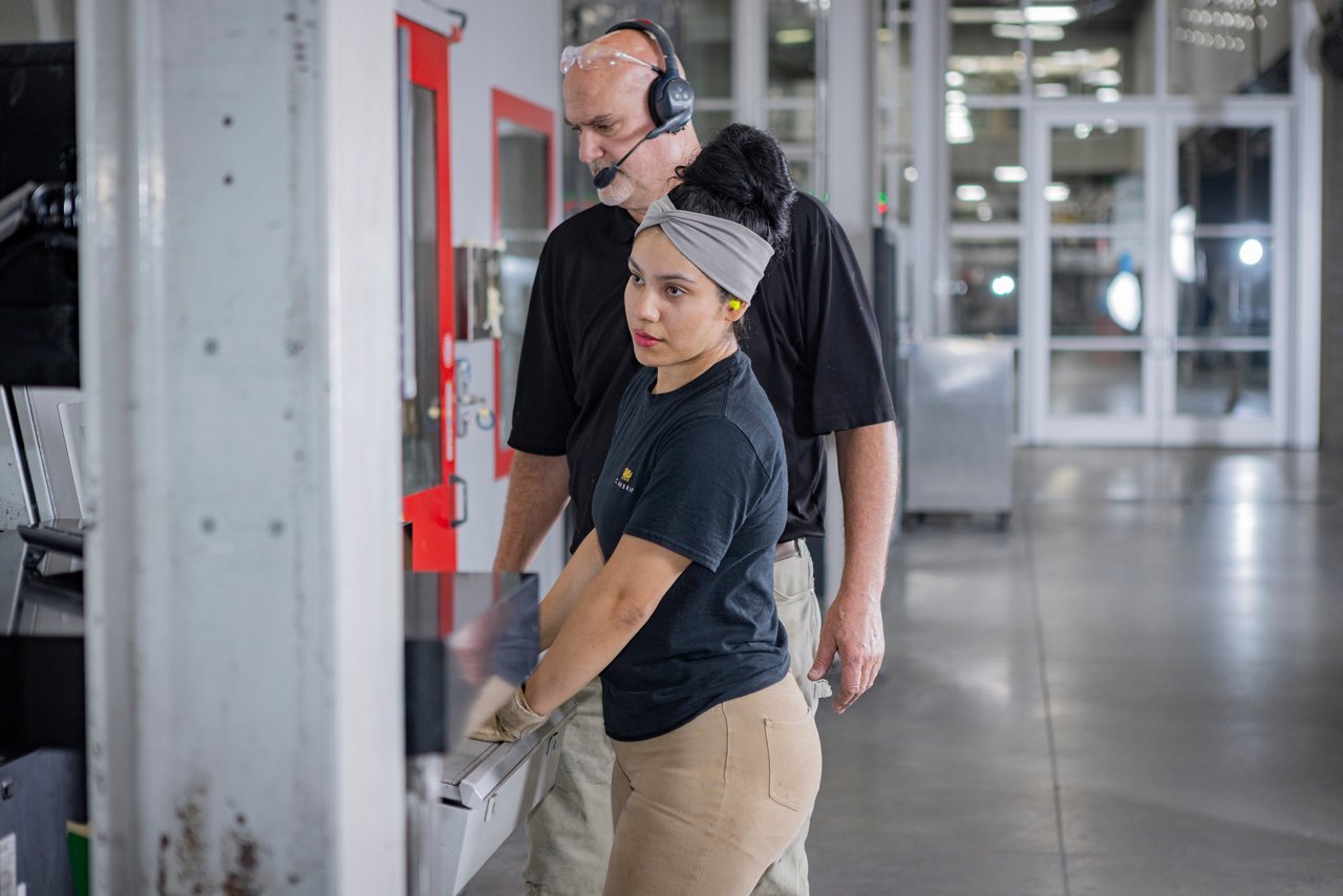 A woman working at a plant line.