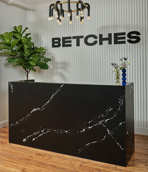 Cambria Blackbrook Matte and White Cliff quartz front desk in Betches headquarters lobby