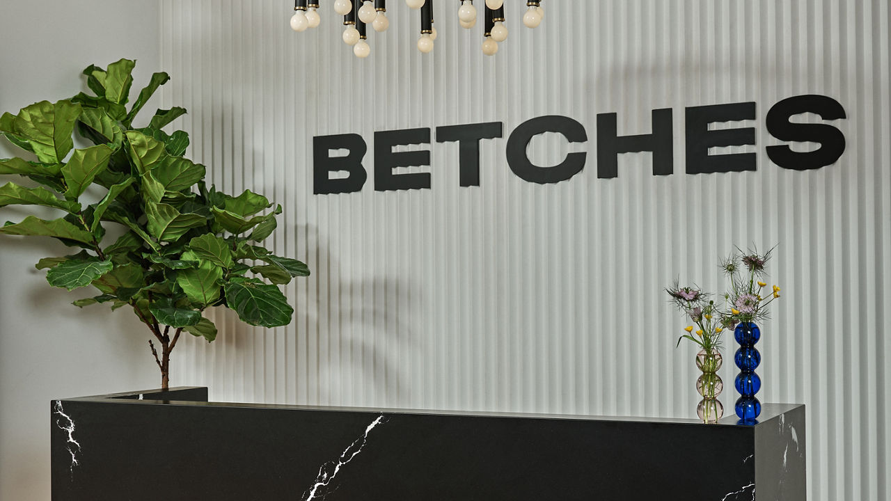 Cambria Blackbrook Matte and White Cliff quartz front desk in Betches headquarters lobby