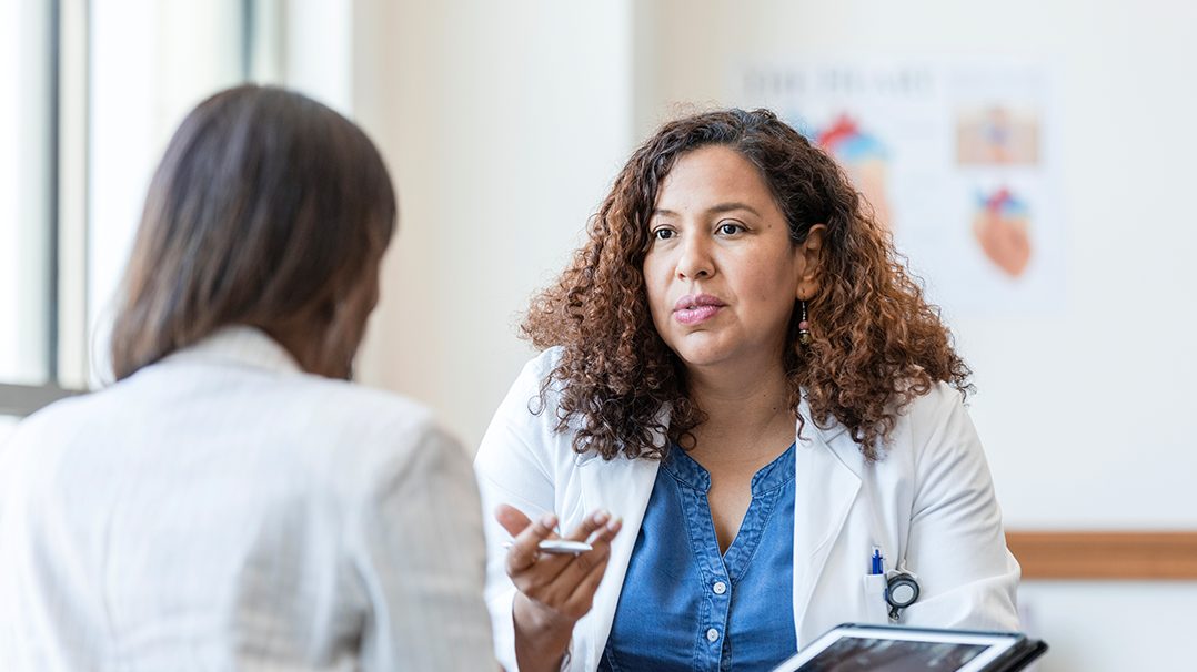 Medical professional talking to patient