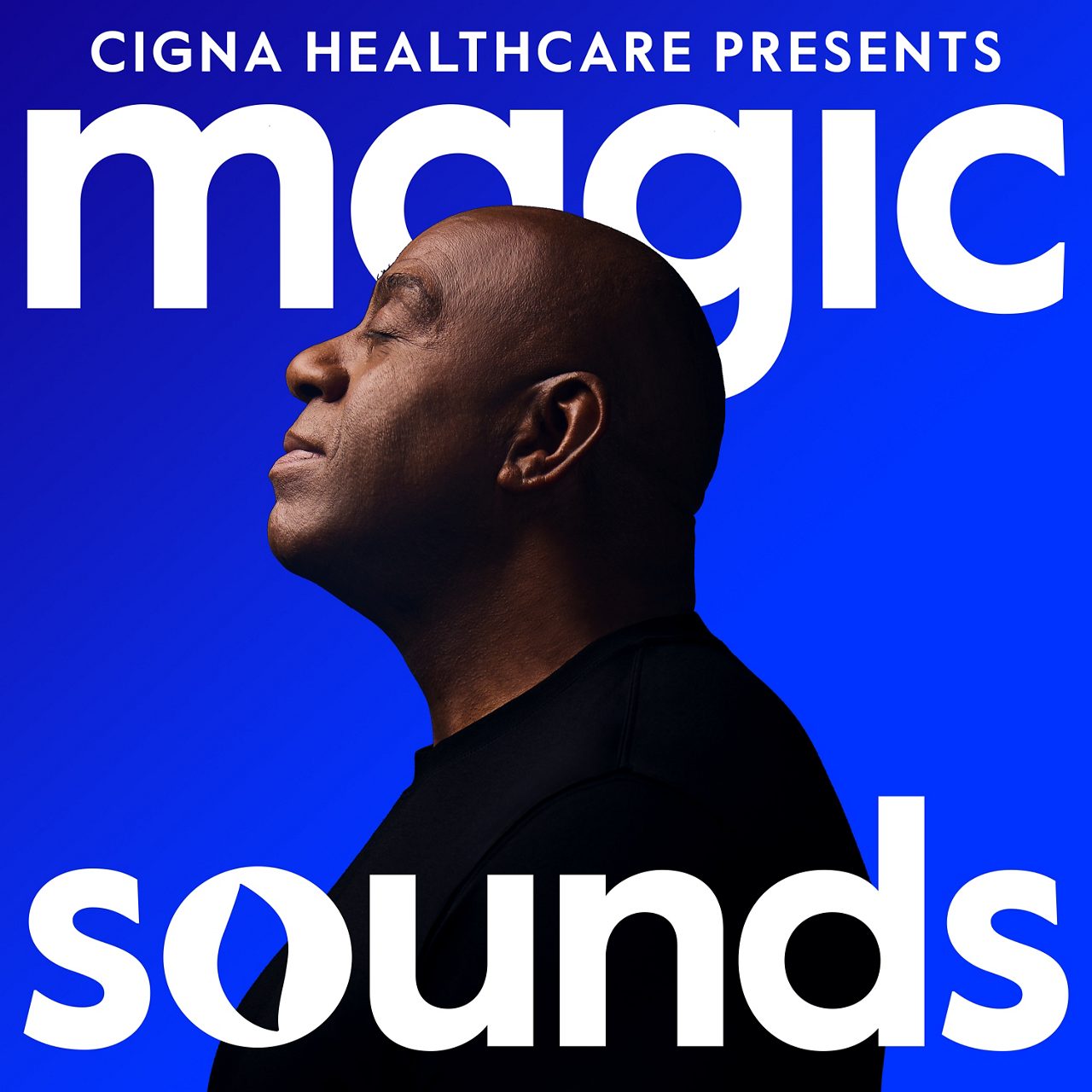 Album cover for 'Magic Sounds' presented by Cigna Healthcare. The design features bold white text on a vibrant blue background. The silhouette of Magic Johnson is visible, adding a dynamic visual element. The text prominently highlights the album name