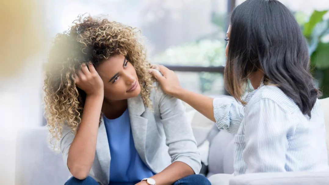 two business women talking