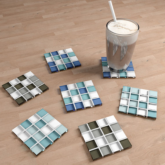 Mosaic tile used as coasters, wood tile under, and a coffee on one of the coasters.