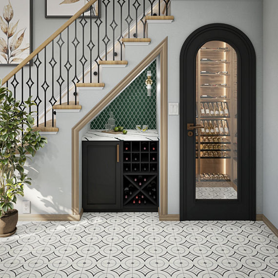 Cupboard under the stairs with green harlequin mosaic tile on back wall niche, black cabinet, white marble look countertop, white walls, and white encaustic floor tile.