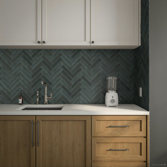 Close up of kitchen with wood cabinets, white countertop, and blue chevron mosaic on backsplash.
